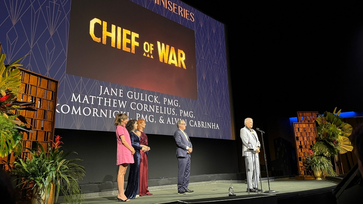 Members of the Chief of War property team stand onstage during the television miniseries presentation.