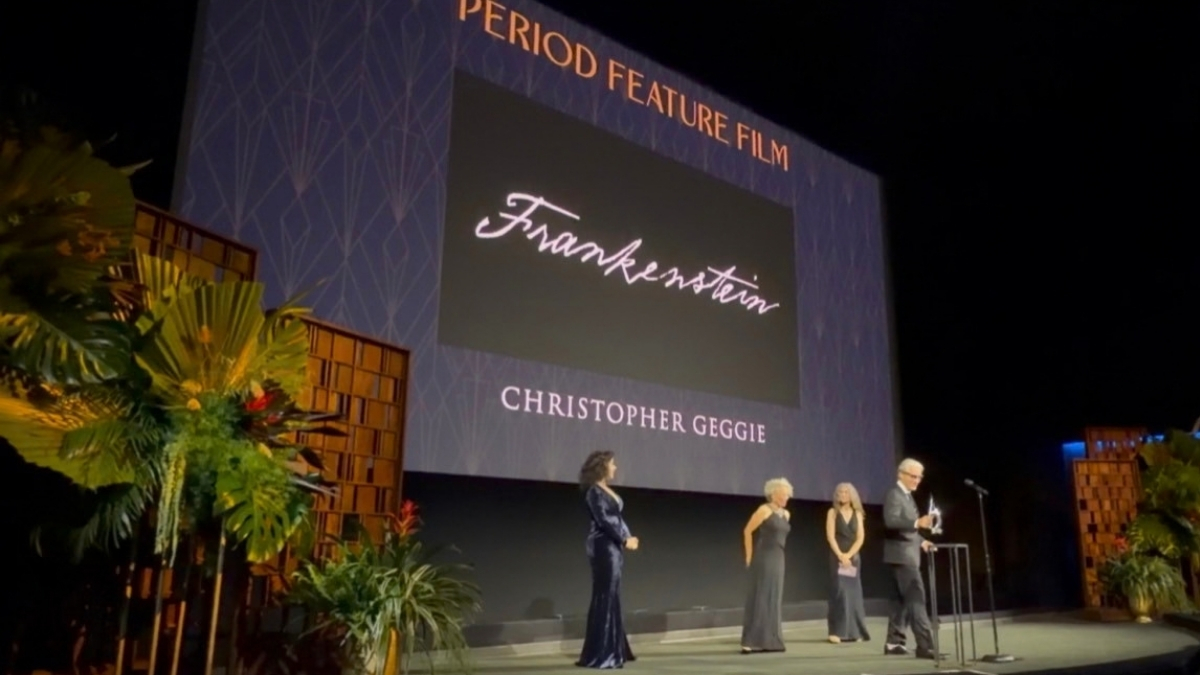 Christopher Geggie stands with his award onstage during the Frankenstein presentation.