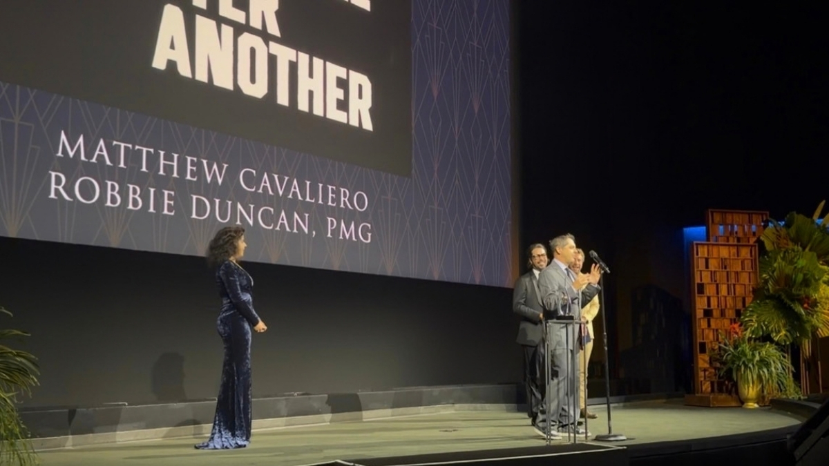 Matthew Cavaliero and Robbie Duncan’s names appear onstage during the One Battle After Another award presentation.
