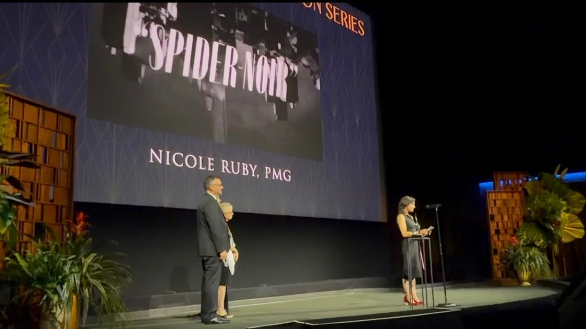 Nicole Ruby’s name appears on the screen during the Spider-Noir award presentation.